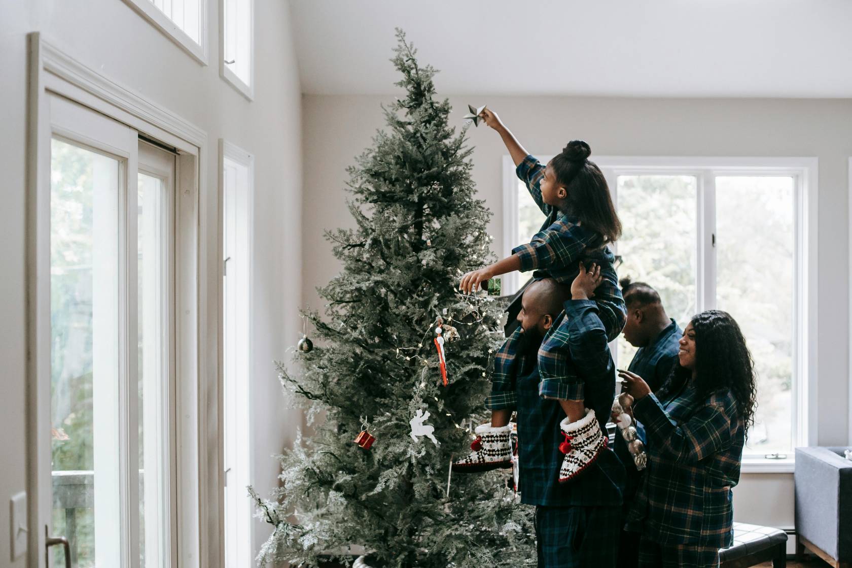 Festive Instagram marketing campaign image featuring Christmas decorations, Christmas tree, event, holiday clothing, and people.